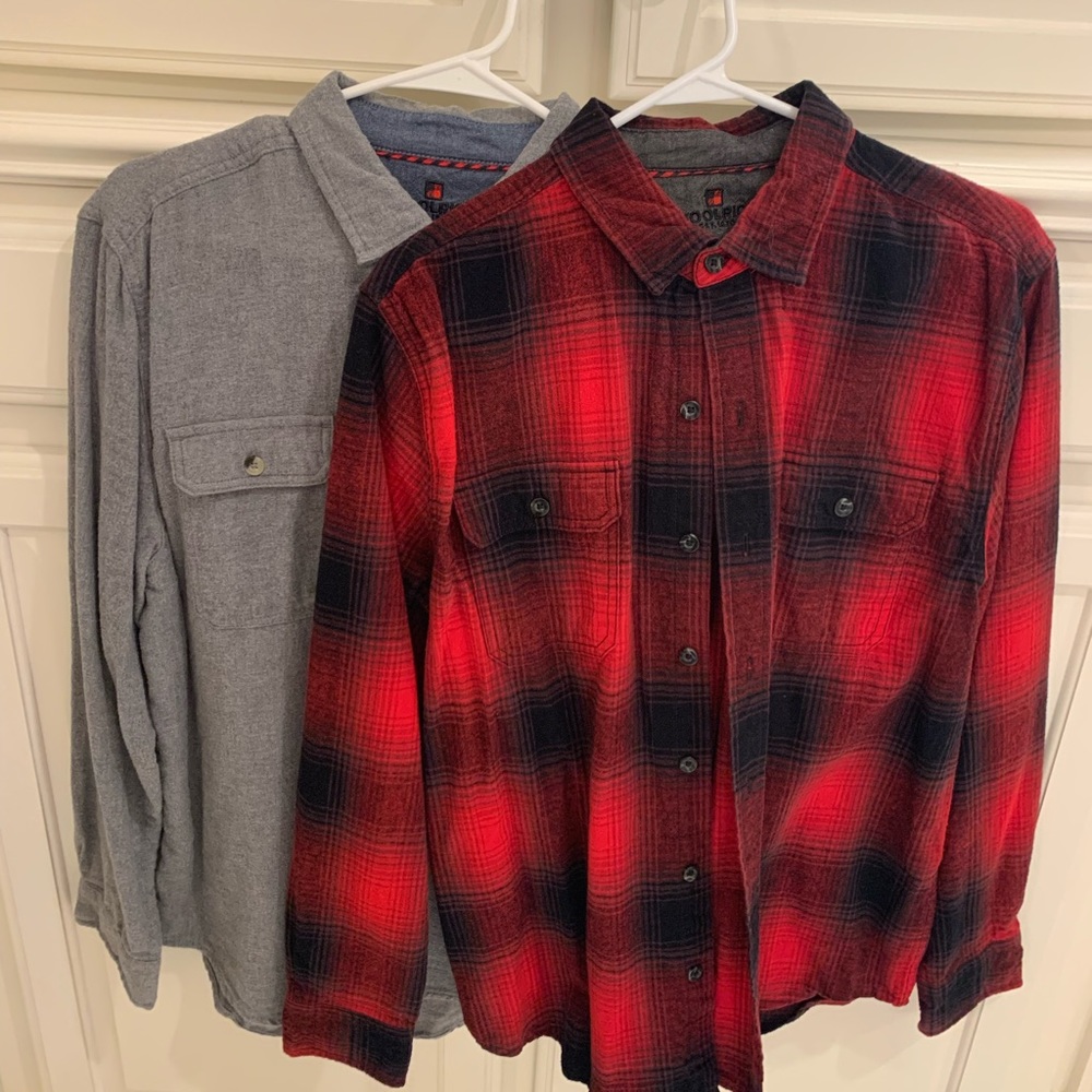 Two Woolrich flannels both large